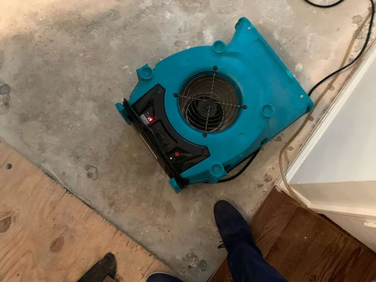 Air mover drying subfloor during Commercial Water Damage Restoration in Verde Village